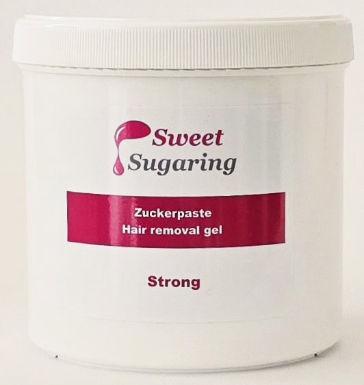 Dose mit Sweet Sugaring Zuckerpaste Strong zur Haarentfernung.